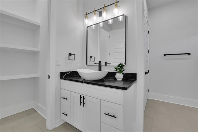 bathroom with vanity and tile patterned flooring