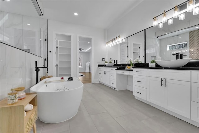 bathroom featuring vanity, tile patterned flooring, and independent shower and bath