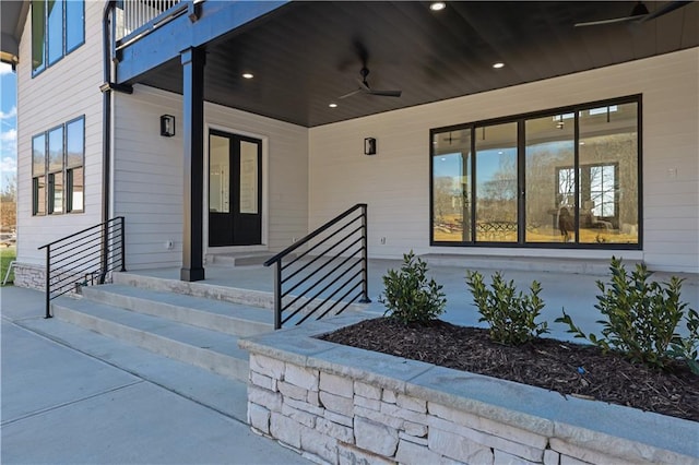 view of exterior entry featuring ceiling fan