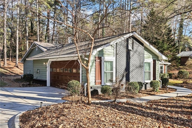 view of side of home with a garage