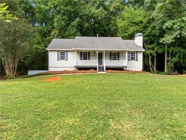 ranch-style home featuring a porch and a front yard