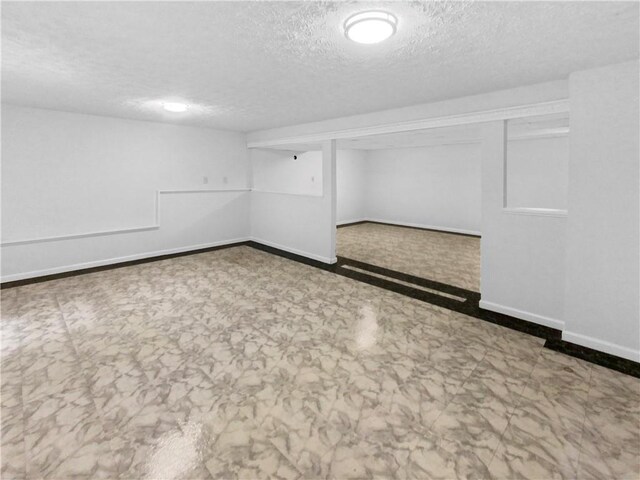 spare room featuring a textured ceiling