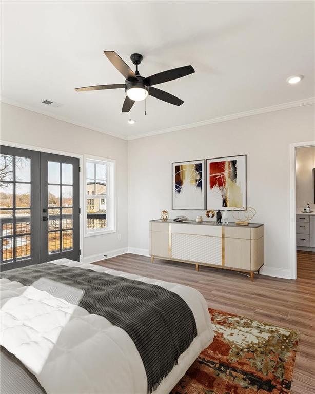 bedroom featuring hardwood / wood-style floors, french doors, crown molding, ceiling fan, and access to exterior