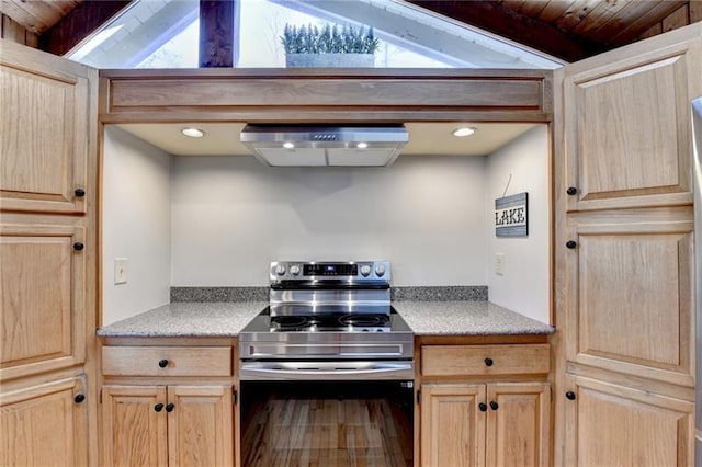 kitchen with stainless steel electric range, light brown cabinets, range hood, light countertops, and vaulted ceiling