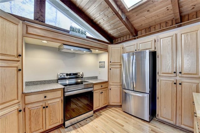 kitchen with stainless steel appliances, light brown cabinetry, beam ceiling, light wood-style flooring, and wood ceiling