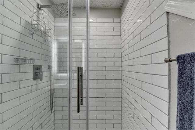 full bath featuring a shower stall