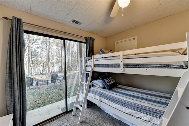 carpeted bedroom with a ceiling fan