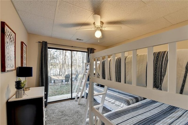 bedroom with carpet, access to exterior, and ceiling fan