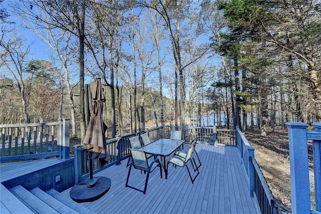 wooden terrace with outdoor dining space