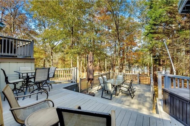 deck featuring outdoor dining area