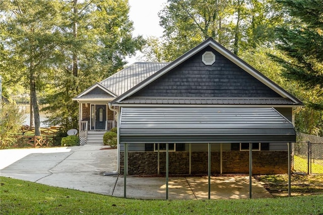 view of side of property featuring a carport