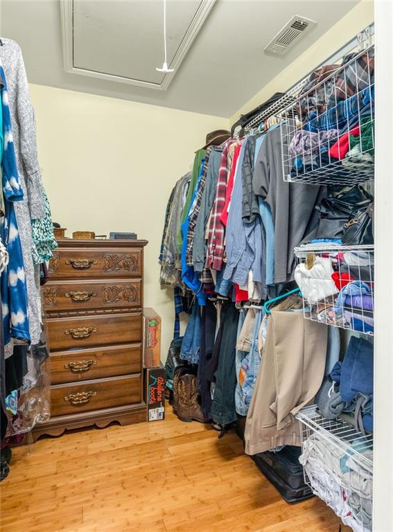 spacious closet featuring hardwood / wood-style flooring