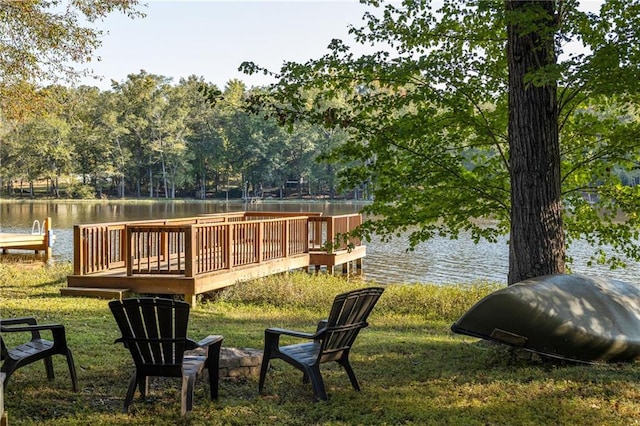 exterior space featuring a water view and a lawn