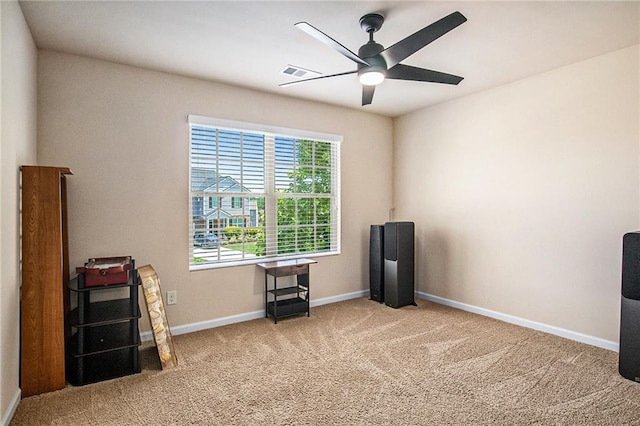 misc room featuring carpet floors, baseboards, a ceiling fan, and visible vents
