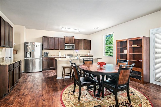 dining room featuring dark wood-style floors