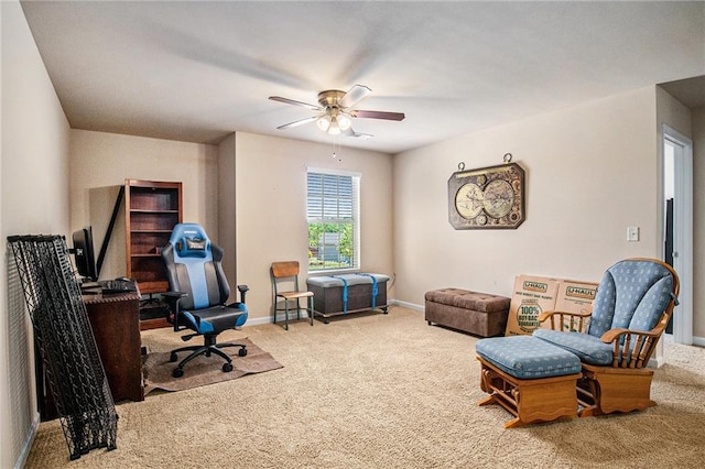 office featuring carpet floors, ceiling fan, and baseboards