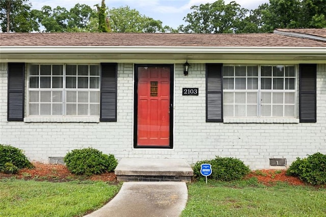 2103 Blue Creek Ct, Conley, GA 30288 - property entrance featuring crawl space, brick siding, and a shingled roof