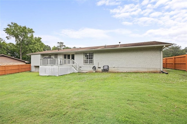 2103 Blue Creek Ct, Conley, GA 30288 - back of property featuring a fenced backyard, brick siding, and a deck