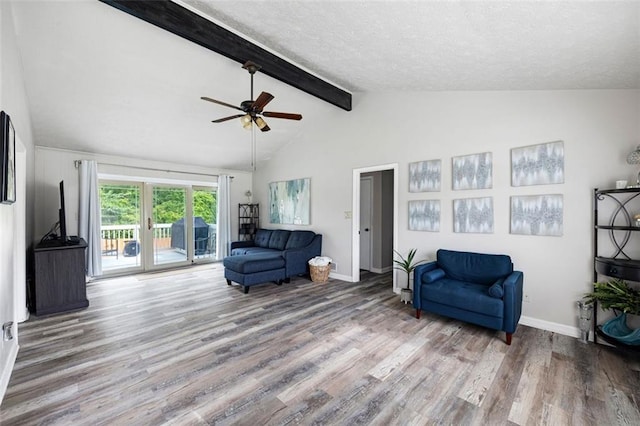2103 Blue Creek Ct, Conley, GA 30288 - living area with wood finished floors, a ceiling fan, and a textured ceiling