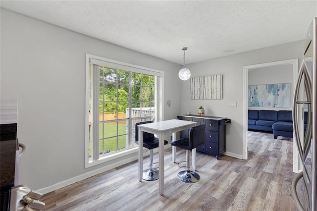 2103 Blue Creek Ct, Conley, GA 30288 - office area with light wood-style floors and a textured ceiling