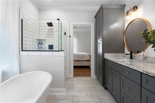 full bathroom featuring ensuite bath, a tile shower, crown molding, a soaking tub, and vanity