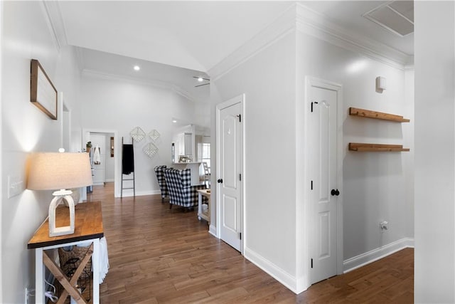 corridor featuring wood finished floors and crown molding