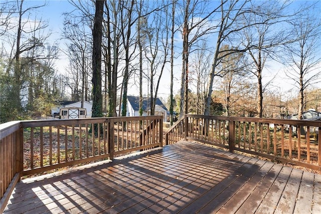 wooden terrace with a storage unit