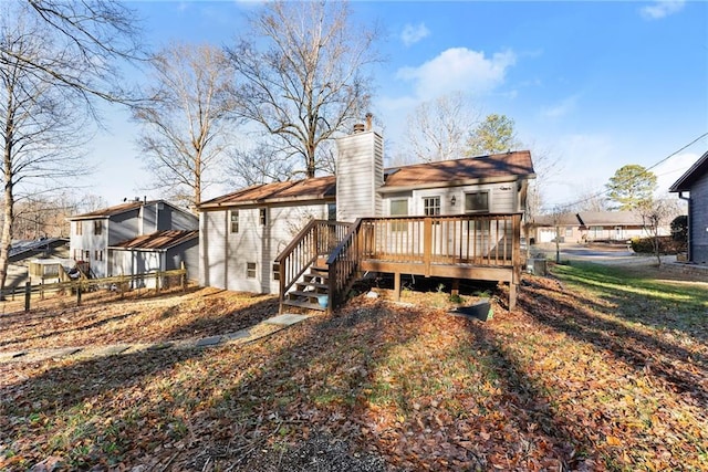 rear view of house featuring a deck