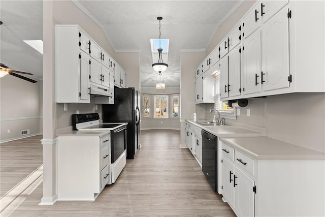 kitchen featuring white cabinetry, sink, white electric range, and decorative light fixtures