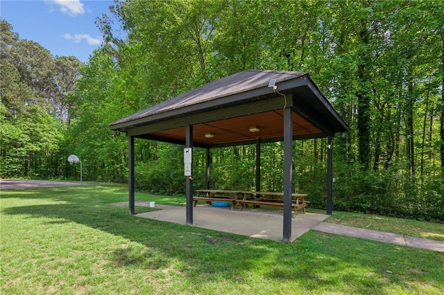 view of property's community with a gazebo and a yard
