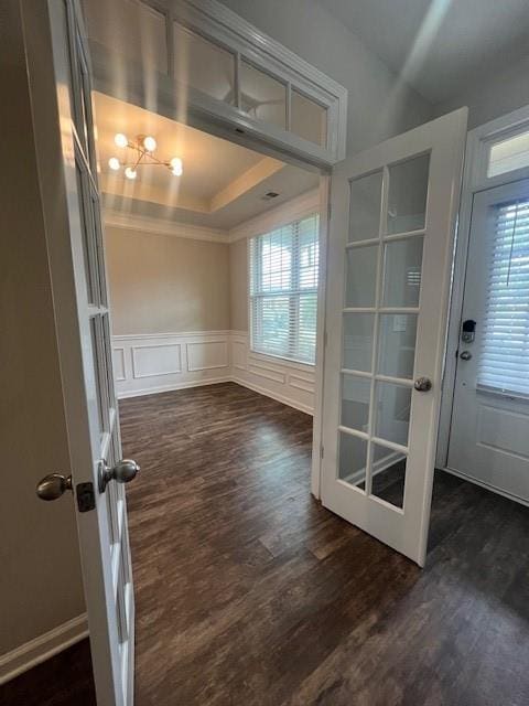 239 Lenore Ct, Hiram, GA 30141 - unfurnished dining area with plenty of natural light, dark wood-type flooring, a decorative wall, wainscoting, and ornamental molding