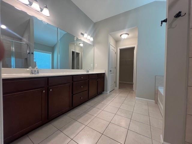 239 Lenore Ct, Hiram, GA 30141 - full bath with double vanity, a stall shower, tile patterned floors, and a garden tub