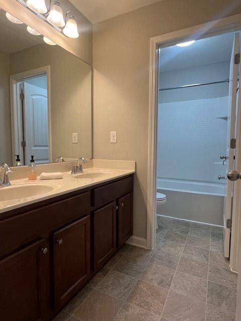 239 Lenore Ct, Hiram, GA 30141 - full bathroom with double vanity, bathing tub / shower combination, and stone finish floors