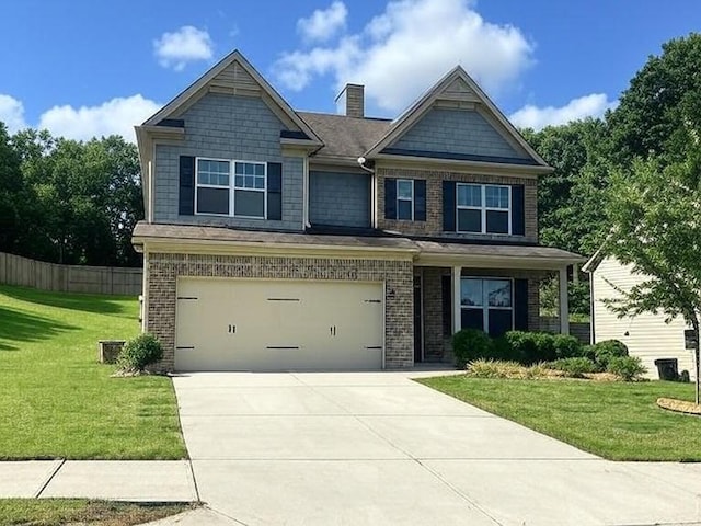 239 Lenore Ct, Hiram, GA 30141 - craftsman inspired home featuring an attached garage, driveway, brick siding, and a chimney