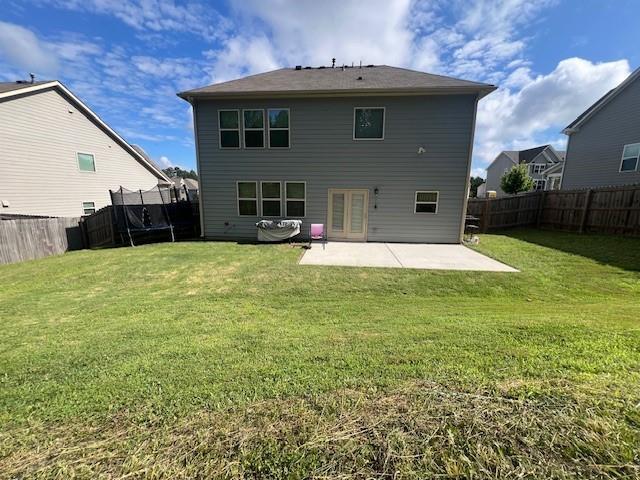239 Lenore Ct, Hiram, GA 30141 - back of property featuring a patio area, a fenced backyard, a trampoline, and french doors
