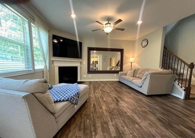 239 Lenore Ct, Hiram, GA 30141 - living room featuring wood finished floors, healthy amount of natural light, a ceiling fan, and stairway