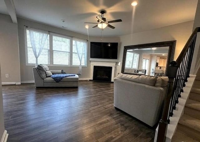 239 Lenore Ct, Hiram, GA 30141 - living area featuring stairs, a ceiling fan, plenty of natural light, and dark wood-style floors
