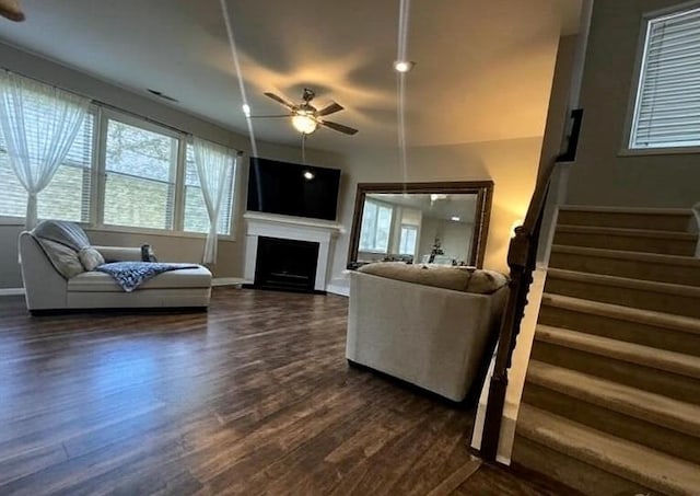 239 Lenore Ct, Hiram, GA 30141 - living room with ceiling fan, dark wood-style floors, stairway, and healthy amount of natural light