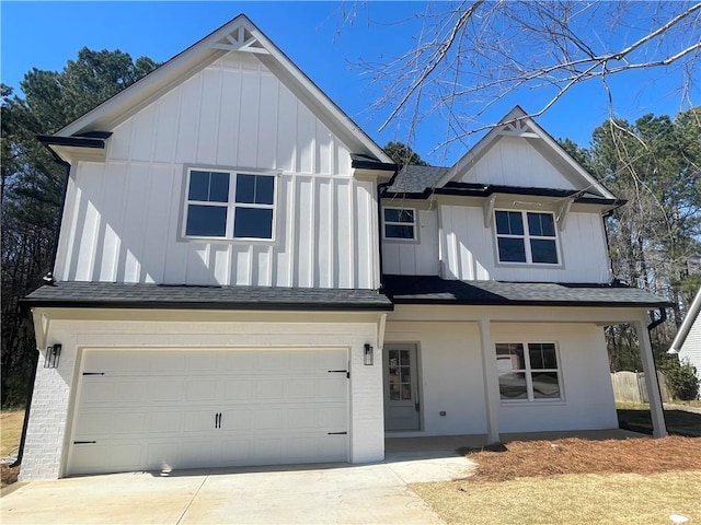 modern farmhouse style home with roof with shingles, board and batten siding, concrete driveway, and an attached garage