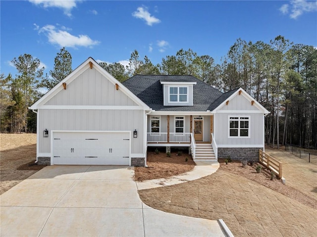 view of front of home with a porch and a garage