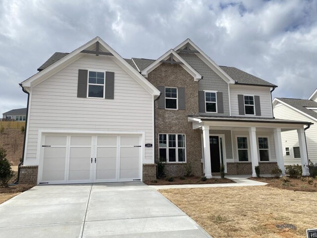 view of front of home with a garage and a porch