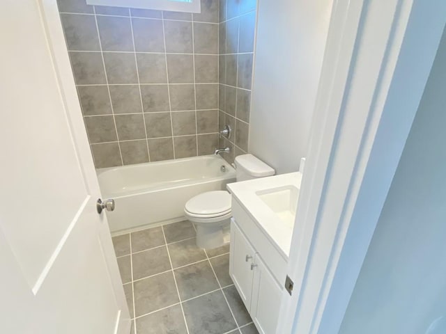 full bath featuring  shower combination, vanity, toilet, and tile patterned floors