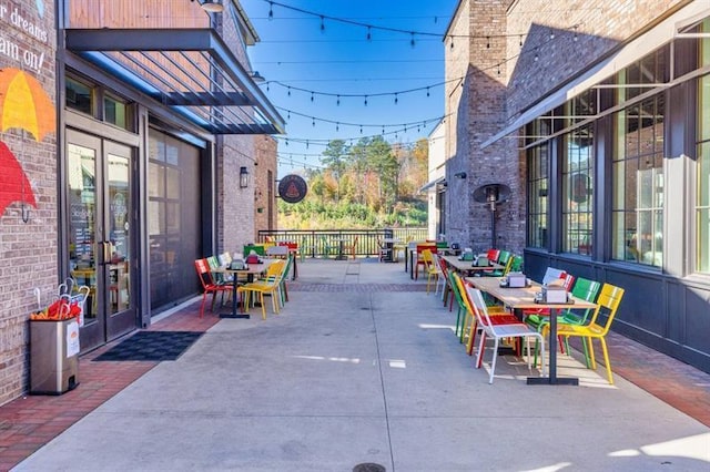 view of patio featuring french doors and outdoor dining area