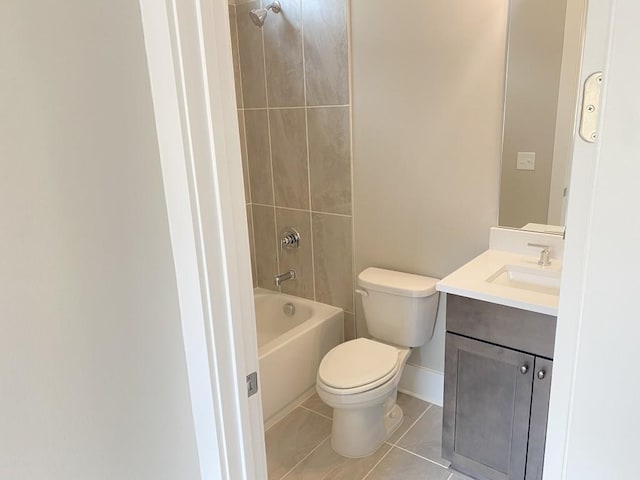 full bath with shower / bath combination, toilet, vanity, baseboards, and tile patterned floors