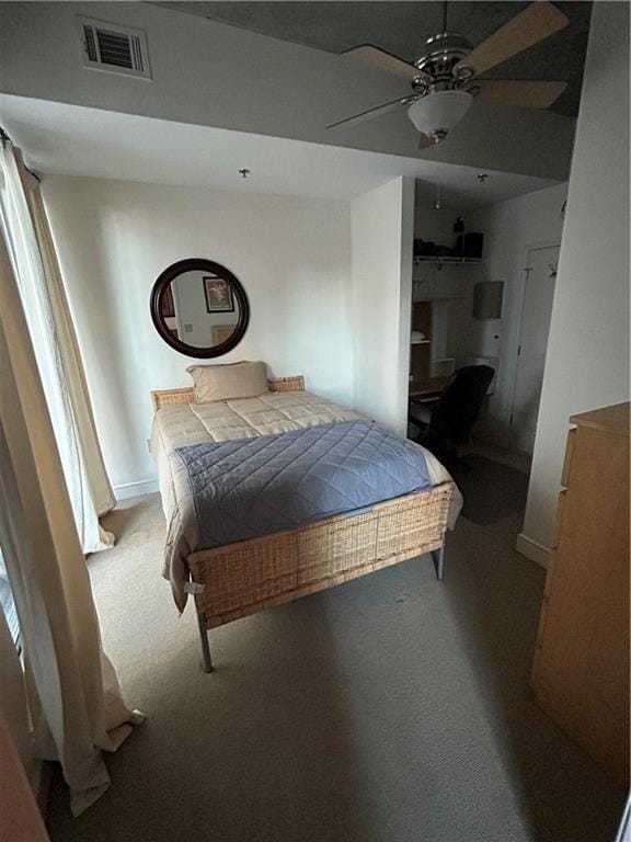 bedroom with ceiling fan and carpet