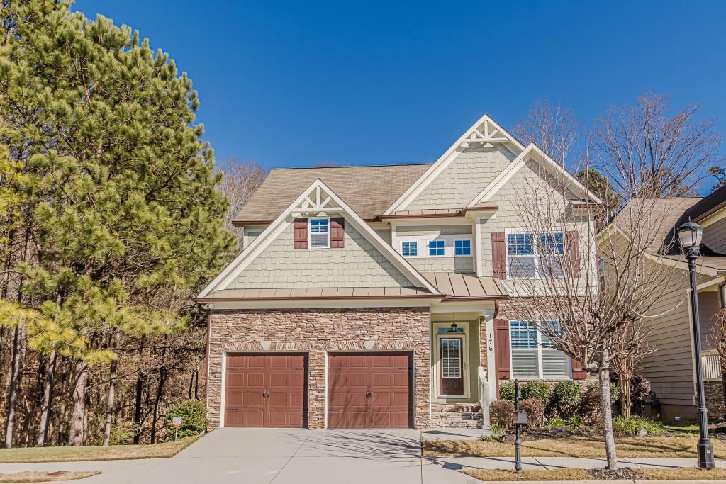 craftsman house with a garage