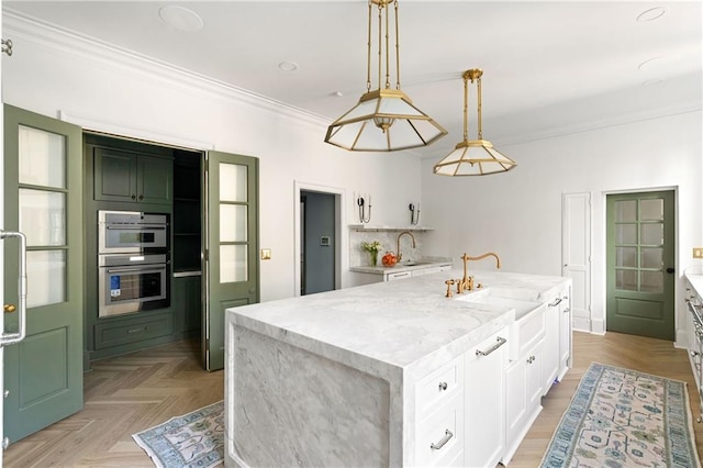 3051 Habersham Rd NW, Atlanta, GA 30305 - kitchen featuring crown molding, stainless steel double oven, white cabinetry, an island with sink, and a sink