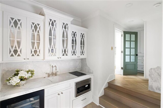 3051 Habersham Rd NW, Atlanta, GA 30305 - interior space with crown molding, wet bar, wine cooler, tasteful backsplash, and stainless steel microwave