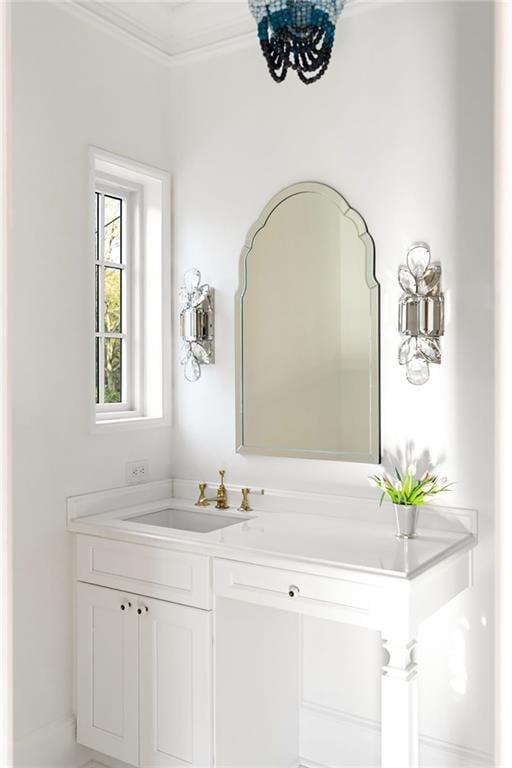3051 Habersham Rd NW, Atlanta, GA 30305 - bathroom with a notable chandelier, vanity, and ornamental molding