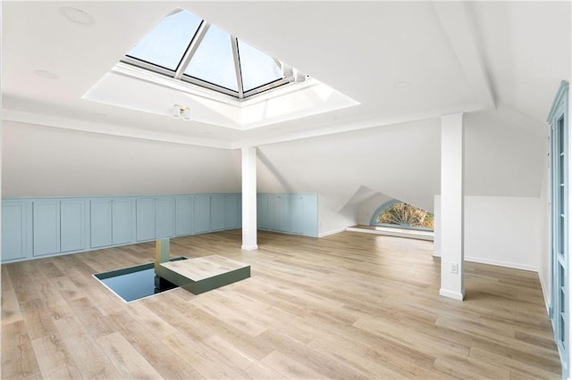 3051 Habersham Rd NW, Atlanta, GA 30305 - additional living space with vaulted ceiling with skylight and light wood-type flooring